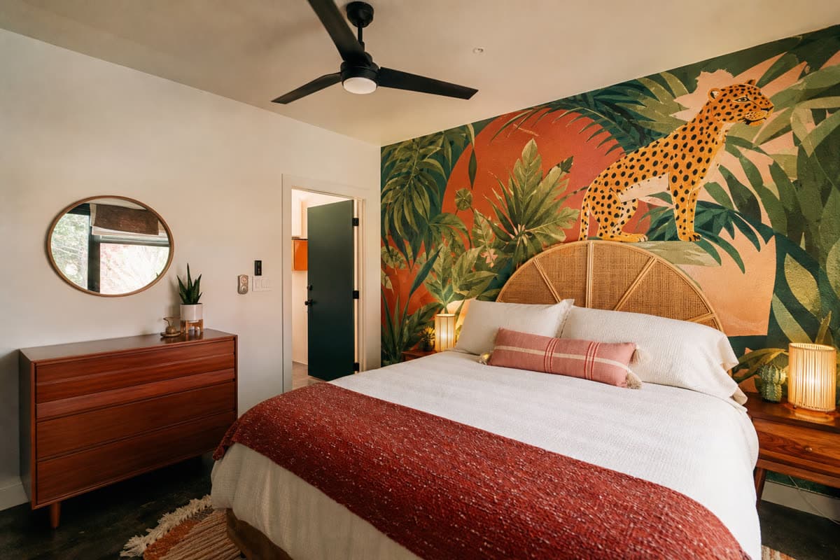 Themed Airbnb rental room with memorable custom wall mural